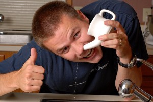 What is a Neti Pot and Why do You Need One guy using a pot